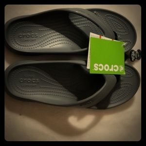 BRAND NEW.  NEVER WORN.  CROCS FLIP FLOPS